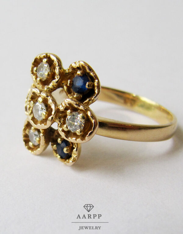 750 Gelbgold Ring Blütenform Diamanten blaue Edelsteinen